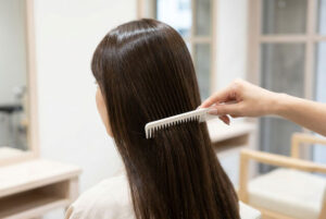 Woman in beauty salon having Keratin treatment Gloucester