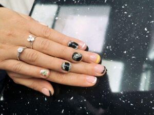 Close-up of a high-quality manicure being completed at a professional nail salon near me Gloucester.
