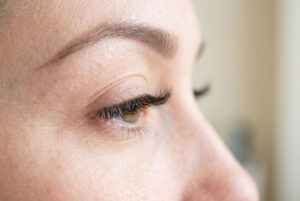 Woman in a salon having done lash extension Gloucester