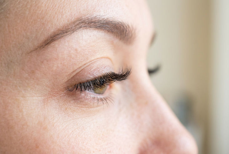 Woman in a salon having done lash extension Gloucester
